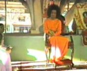 This hour-long video gives a glimpse into the past: darshan and bhajans (devotional singing) in Brindavan, Whitefield, near Bangalore.nnThe first part shows people waiting for darshan (sight of a holy person). Sathya Sai Baba comes and walks around, taking letters, talking to people. There is no music in this part, just crows cawing, people talking, Sai Baba talking, cars beeping, a train passing by. We see the great banyan tree, around which a structure has been placed to protect from the sun.n