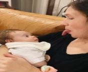 This baby girl was in her mom&#39;s arms when her mom started sticking her tongue out at her. The smart baby instantly copied her and stuck out her tongue too. Her mesmerized parents laughed out loud as she copied her mom for the first time.