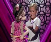 Darci performs on stage with her puppet Edna, about her love for Simon.