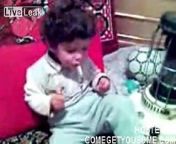 Iranian child smoking opium at about three years old.