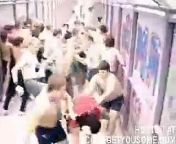 Large group fights it out in an enclosed walkway... This is just plain nuts.