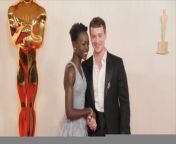 Red Carpet Fashion , at the 2024 Oscars.&#60;br/&#62;Red Carpet Fashion , at the 2024 Oscars.&#60;br/&#62;The 96th Academy Awards &#60;br/&#62;took place on March 10.&#60;br/&#62;The 96th Academy Awards &#60;br/&#62;took place on March 10.&#60;br/&#62;Here&#39;s a look at what stars wore to the event:.&#60;br/&#62;Here&#39;s a look at what stars wore to the event:.&#60;br/&#62;Cynthia Erivo, The &#39;Wicked&#39; star stunned in a green frilly dress.&#60;br/&#62;Ariana Grande, Grande turned heads in a pink puffy gown.&#60;br/&#62;Michelle Yeoh, &#39;The Brothers Sun&#39; actress sparkled in silver.&#60;br/&#62;Cillian Murphy, The &#39;Oppenheimer&#39; actor looked &#60;br/&#62;dapper in a black suit and bowtie. .&#60;br/&#62;Florence Pugh, Pugh stunned in a silver gown.&#60;br/&#62;Da&#39;Vine Joy Randolph, &#39;The Holdovers&#39; star looked &#60;br/&#62;radiant in a shimmering blue gown.&#60;br/&#62;Sandra Hüller, The &#39;Anatomy of a Fall&#39; actress stood out &#60;br/&#62;in a black gown with pointed shoulders.&#60;br/&#62;Zendaya, The &#39;Dune&#39; star rocked a pink dress with palm leaves.&#60;br/&#62;America Ferrera, The &#39;Barbie&#39; actress was mesmerizing in her shiny pink gown.&#60;br/&#62;Danielle Brooks, &#39;The Color Purple&#39; star commanded &#60;br/&#62;attention in a strapless corset black gown.&#60;br/&#62;Ryan Gosling, The &#39;Barbie&#39; actor wore a black suit with silver trim.&#60;br/&#62;Billie Eilish, The singer wore a white shirt with a blazer, &#60;br/&#62;paired with a tweed skirt and white socks.