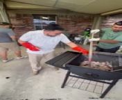 These guys bought a new barbecue after accidentally burning a hole through their old one. Here, they were transferring the hot charcoal from the old barbecue to the new one.
